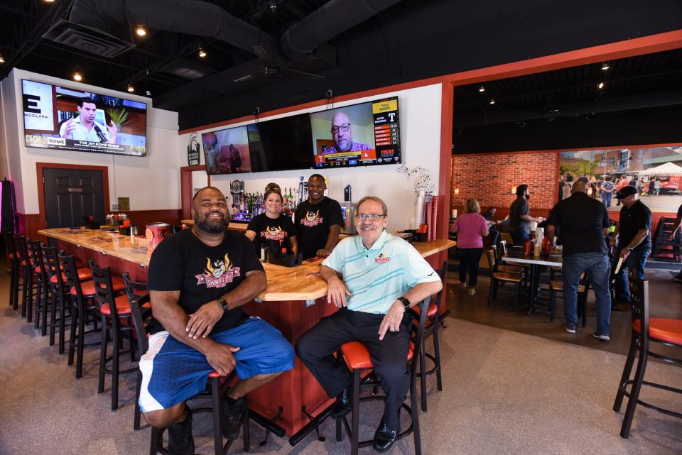 From left. Smoke 'n Pig BBQ owners Gabe Jones, Kerissah Ries, Steve Fountain, and Bryan Torok, pictured Wednesday, Aug. 9, 2023, in the newly-opened bar of their BBQ restaurant.