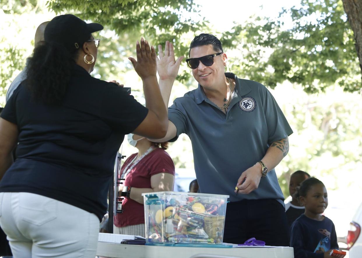 A man high-fives a woman