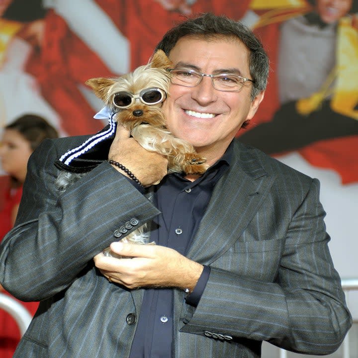 Kenny Ortega holding his dog