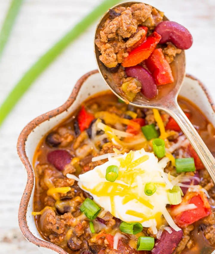 Whether it’s winter or summer, we say anytime is a good time for a hearty bowl of <a rel="nofollow noopener" href="https://www.eatthis.com/chili-recipes/?utm_source=yahoo-news&utm_medium=feed&utm_campaign=yahoo-feed" target="_blank" data-ylk="slk:chili;elm:context_link;itc:0" class="link ">chili</a>. This recipe features staples like ground beef, kidney and black beans with cheese and veggies for a spicy protein-packed meal that will fill you up, yet still have you wanting seconds. <strong>Get the recipe from <a rel="nofollow noopener" href="https://www.averiecooks.com/slow-cooker-beef-chili/" target="_blank" data-ylk="slk:Averie Cooks;elm:context_link;itc:0" class="link ">Averie Cooks</a>.</strong>