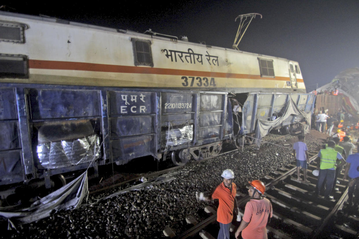 Rescuers work at the site of passenger trains accident, in Balasore district, in the eastern Indian state of Orissa, Saturday, June 3, 2023. Two passenger trains derailed in India, killing more than 200 people and trapping hundreds of others inside more than a dozen damaged rail cars officials said. (AP Photo)