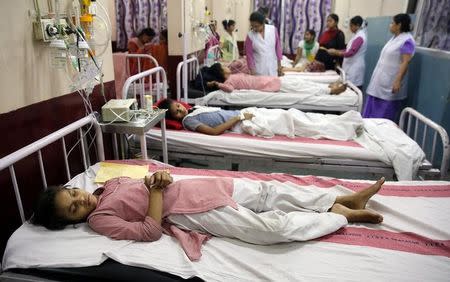 Children lie on hospital beds as they receive treatment after complaining of breathlessness and eye irritation following a gas leak from a fuel tanker in New Delhi, India, May 6, 2017. REUTERS/Stringer