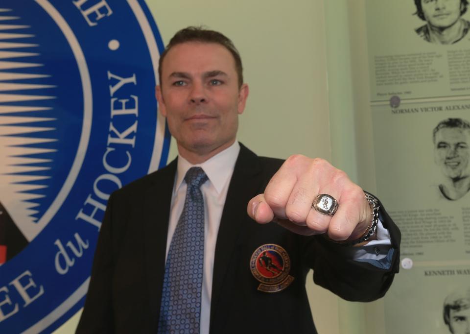 TORONTO, ON - NOVEMBER 12: Adam Oates poses with his Hall of Fame ring at the Hockey Hall of Fame ring ceremony on November 12, 2012 in Toronto, Canada. Oates and three other former NHL players will be inducted into the Hall during a ceremony later today. (Photo by Bruce Bennett/Getty Images)