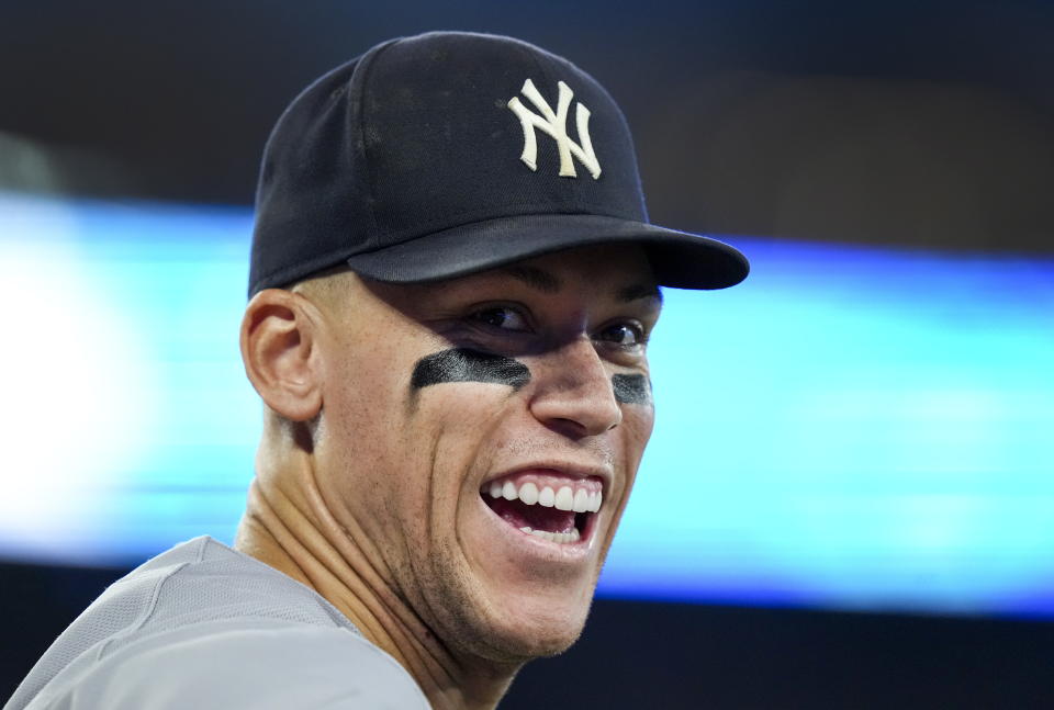 New York Yankees center fielder Aaron Judge smiles to the crowd during the ninth inning of the team's baseball game against the Toronto Blue Jays on Tuesday, Sept. 27, 2022, in Toronto. (Nathan Denette/The Canadian Press via AP)