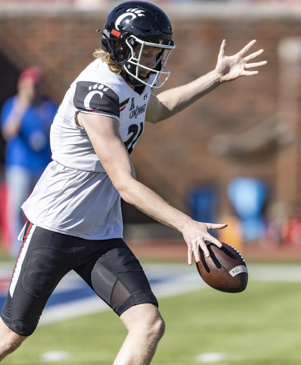 Cincinnati punter Mason Fletcher (31) punts the ball during the first half of an NCAA college football game against against SMU, Saturday, Oct. 22, 2022, in Dallas. (AP Photo/Brandon Wade)