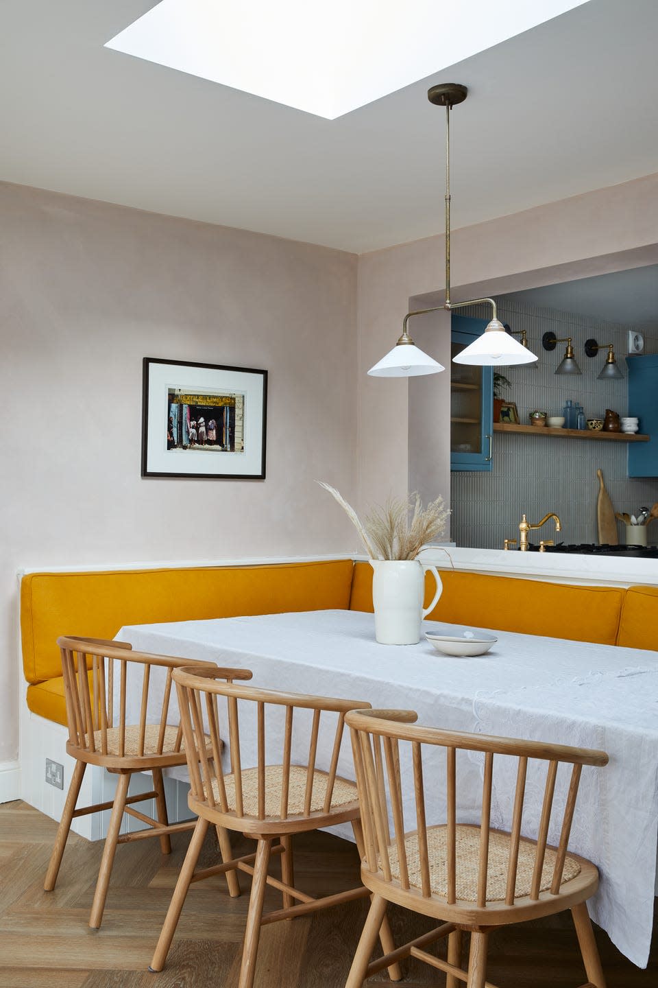 <p>Lashings of plump mustard upholstery complement the blue <a href="https://www.housebeautiful.com/uk/decorate/kitchen/g35138029/kitchen-cupboard-paint/" rel="nofollow noopener" target="_blank" data-ylk="slk:kitchen cabinets;elm:context_link;itc:0;sec:content-canvas" class="link ">kitchen cabinets</a> in this desirable home, and make the best possible use of space under the opening.</p><p>Pictured: A project by <a href="https://vaughandesignanddevelopment.com/" rel="nofollow noopener" target="_blank" data-ylk="slk:Vaughan Design & Development;elm:context_link;itc:0;sec:content-canvas" class="link ">Vaughan Design & Development</a>.</p><p><strong>Follow House Beautiful on <a href="https://www.instagram.com/housebeautifuluk/" rel="nofollow noopener" target="_blank" data-ylk="slk:Instagram;elm:context_link;itc:0;sec:content-canvas" class="link ">Instagram</a>.</strong></p>