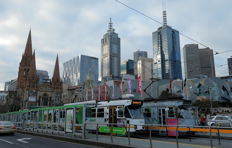 FILE PHOTO: Trams pass by Melbourne’s city skyline in Australia’s second-largest city