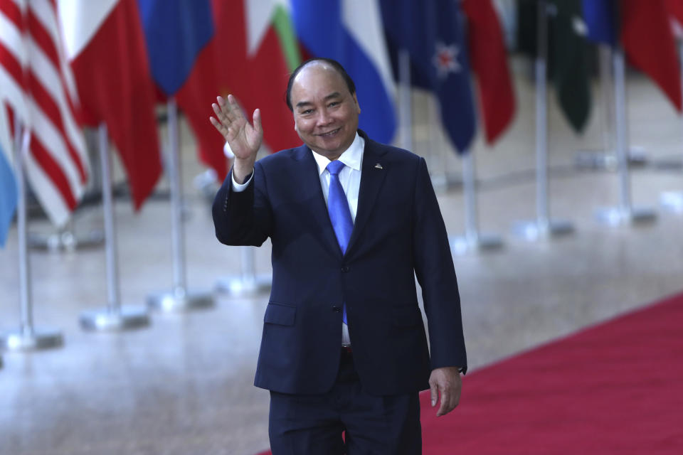 Vietnam's Prime Minister Nguyen Xuan Phuc arrives for the ASEM 12 in Brussels, Thursday, Oct. 18, 2018. The informal meeting, which is held every two years, will discuss peace moves on the Korean Peninsula, migration, cybersecurity, fighting extremism and combating climate change. (AP Photo/Francisco Seco)