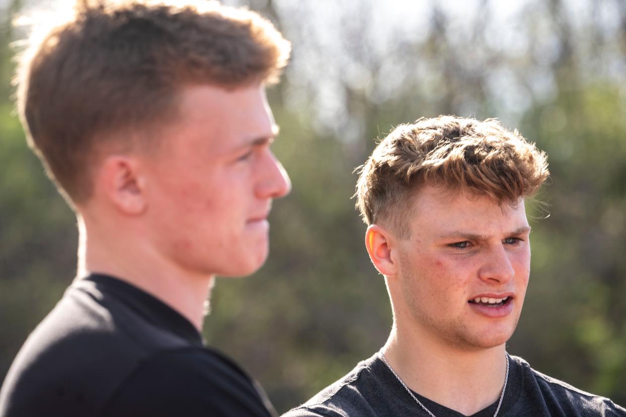 Iowa State football commit Aiden Flora, right, speaks during an interview at ADM High School on Wednesday in Adel.