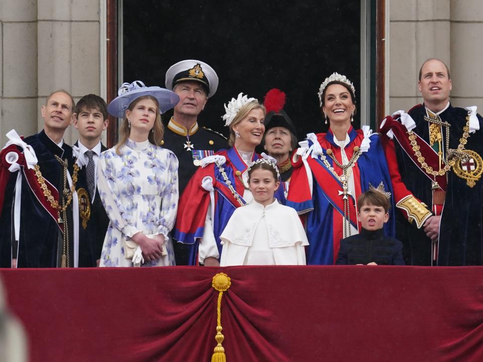 Members of the royal family stand on the balcony of Buckingham Palace after the coronation of King Charles.