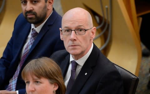 Scottish Education Secretary John Swinney during a debate in the Scottish Parliament, where he is under pressure to scrap testing of Primary One pupils - Credit: Corbis News