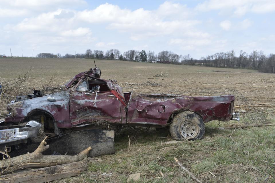 One of Calvin Bowman's trucks was crushed by the March 31 tornado in Owen County.