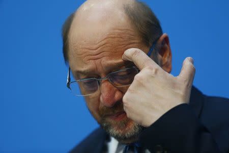 Social Democratic Party (SPD) leader Martin Schulz reacts during a statement with Christian Democratic Union (CDU) leader and German Chancellor Angela Merkel and Christian Social Union (CSU) leader Horst Seehofer after coalition talks to form a new coalition government in Berlin, Germany, February 7, 2018. REUTERS/Hannibal Hanschke