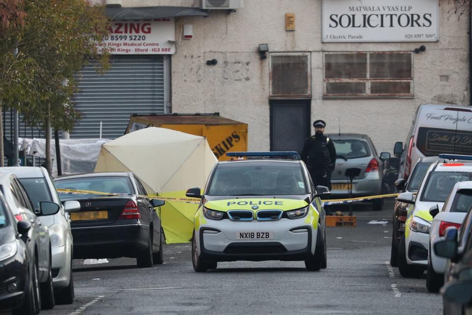A tent has been set up by police within the cordon (PA)