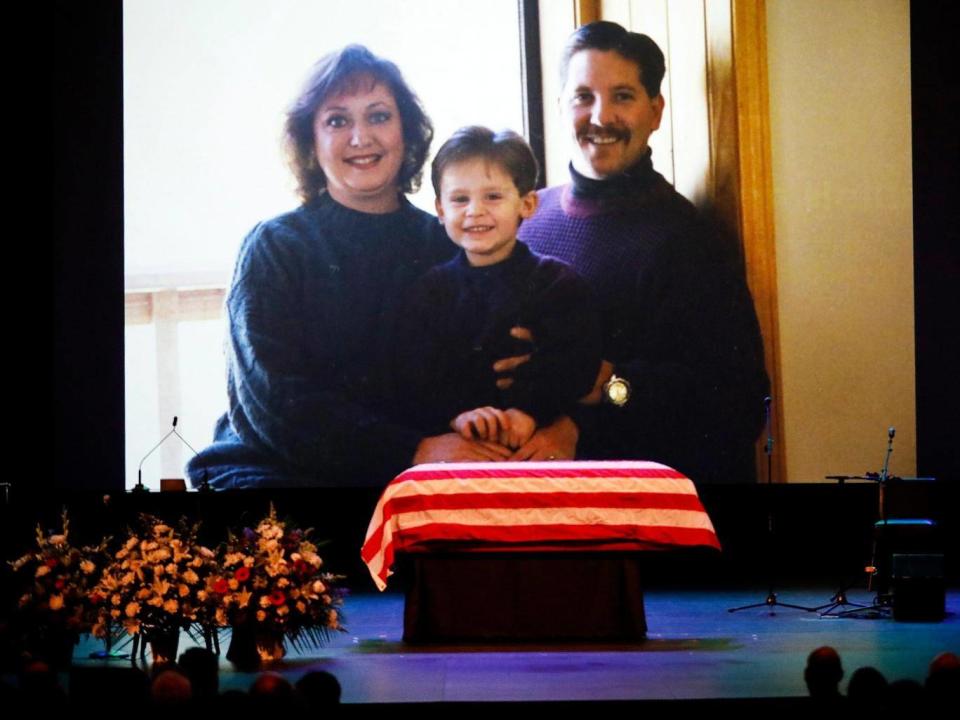 A family photo shown during a video montage of Ventura County Sheriff Sgt. Ron Helus with his wife Karen and son Jordan years ago. Sgt. Helus was one of twelve victims of the Borderline Bar & Grill mass shooting in Thousand Oaks, California, on 7 November, 2018. (EPA)