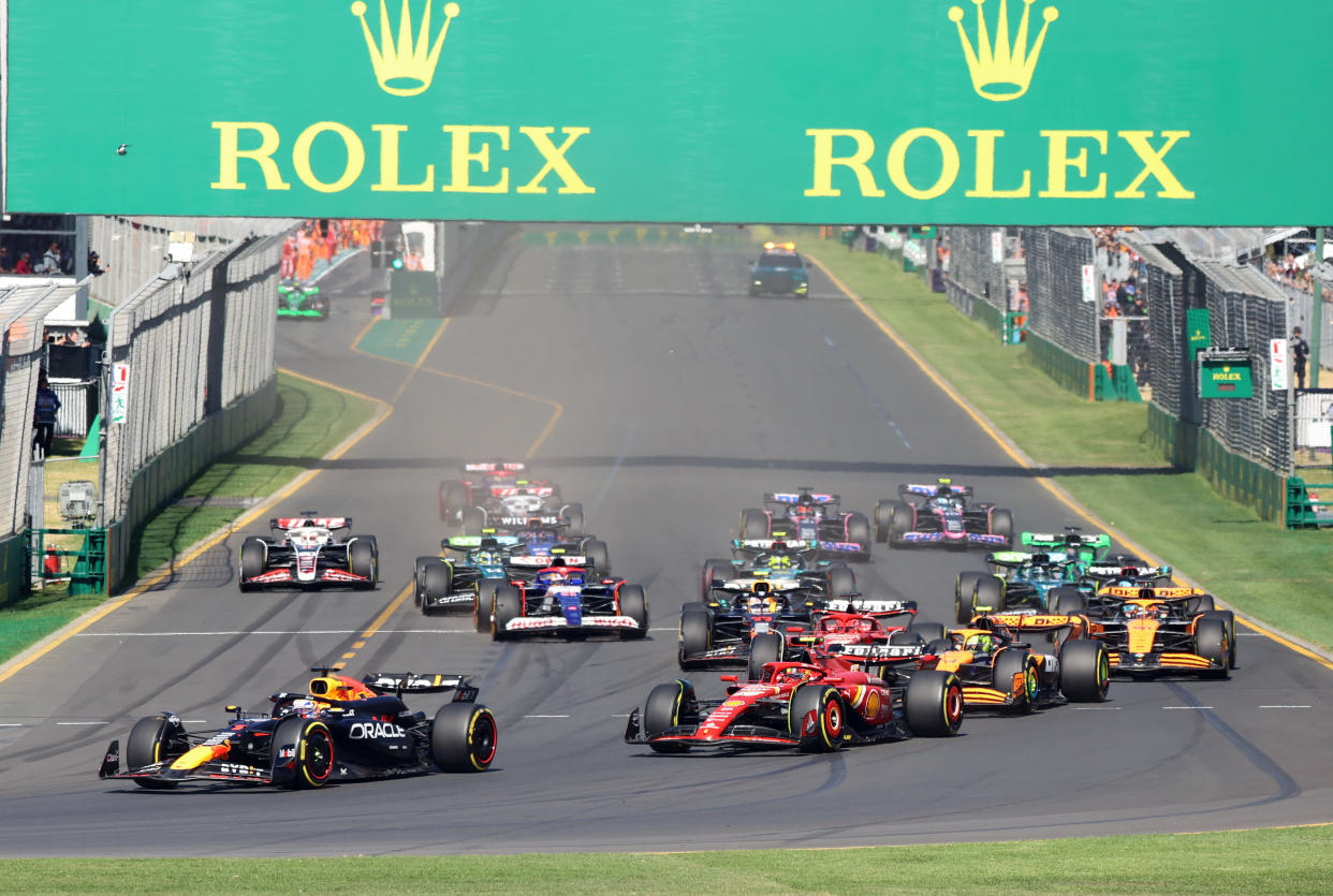 MELBOURNE, AUSTRALIA - MARCH 24: Carlos Sainz of Spain driving the Ferrari SF-24 and Max Verstappen of the Netherlands driving the Oracle Red Bull Racing RB19 and Lando Norris of Great Britain driving the McLaren F1 Team MCL60 on track during the F1 Grand Prix of Australia at Albert Park Circuit on March 24, 2024 in Melbourne, Australia. (Photo by Clay Cross ATPImages/Getty Images)