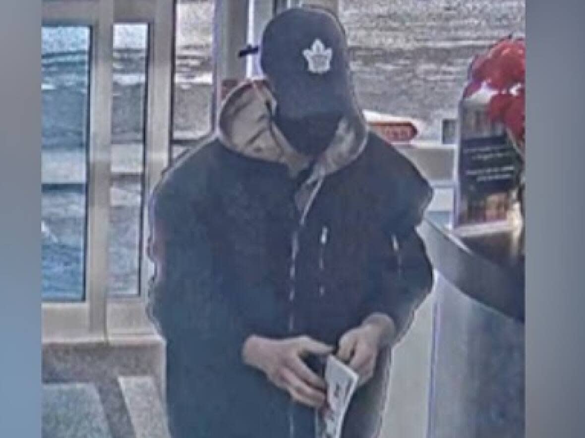 Police say this man is a suspect in the theft of a Gibson Les Paul custom worth around $8,000. (York Regional Police - image credit)