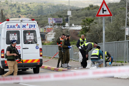 Israeli forensic police inspect the scene of Palestinian shooting attack near the Jewish settlement of Ariel, in the occupied West Bank March 17, 2019. REUTERS/Ammar Awad