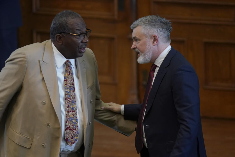 Dr. Andy Keller, President and CEO of Meadow Mental Health Policy Institute, right, talk with State Sen. Royce West, D-Dallas, left, after he testified on the second day of a hearing in the state senate chamber, Wednesday, June 22, 2022, in Austin, Texas. The hearing is in response to the recent school shooting at Robb Elementary School in Uvalde, Texas, where two teachers and 19 students were killed. (AP Photo/Eric Gay)