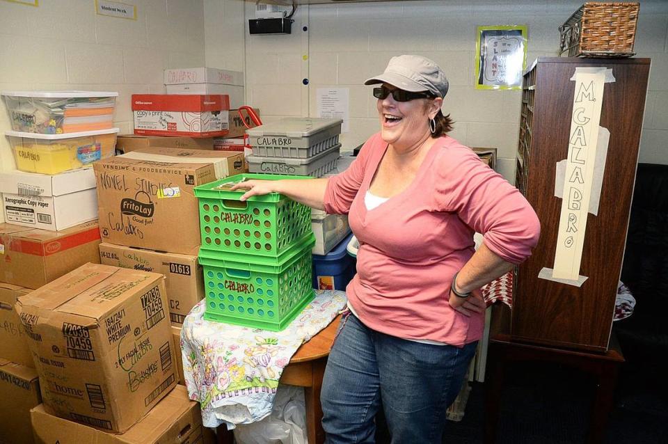 Teacher Marie Calabro smiles as she finishes moving her classroom furniture into a storage room at her new school, Bruns Academy on S. Bruns Ave. in Charlotte, in this 2014 file photo. Calabro was among the initial teachers in Charlotte Mecklenburg’s Opportunity Culture program that is expanding into Wake County.