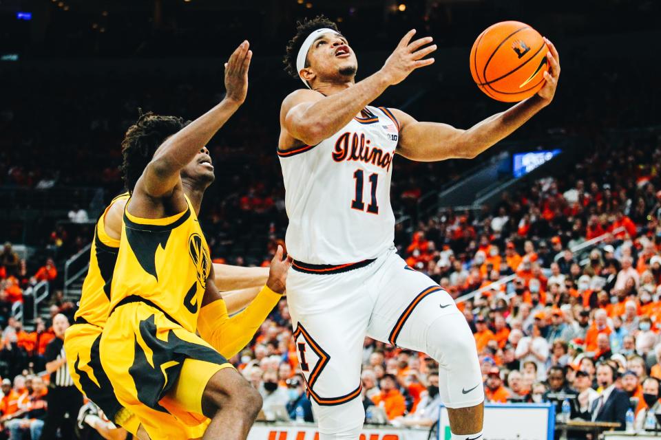 Illinois' Alfonso Plummer (11) drives toward the basket against Missouri's Anton Brookshire (0) on Wednesday night in St. Louis.