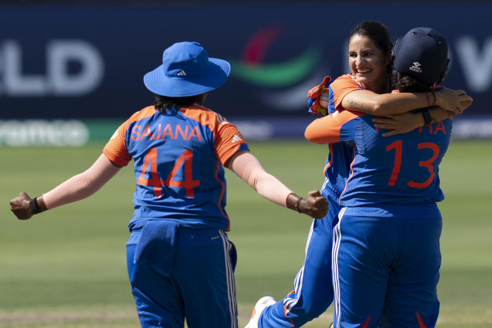 India's Renuka Singh, facing camera, celebrates the wicket of Pakistan's Gull Feroza with her teammates during the ICC Women's T20 World Cup 2024 match between Pakistan and India at Dubai International Stadium, United Arab Emirates, Sunday, Oct. 6, 2024. (AP Photo/Altaf Qadri)