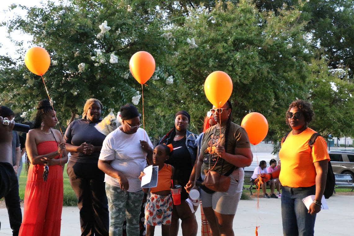 Orange balloons were released Friday evening at a vigil in downtown Fort Worth to honor victims killed in recent shootings in Fort Worth, including those fatally shot in the Como neighborhood on Monday, July 3.