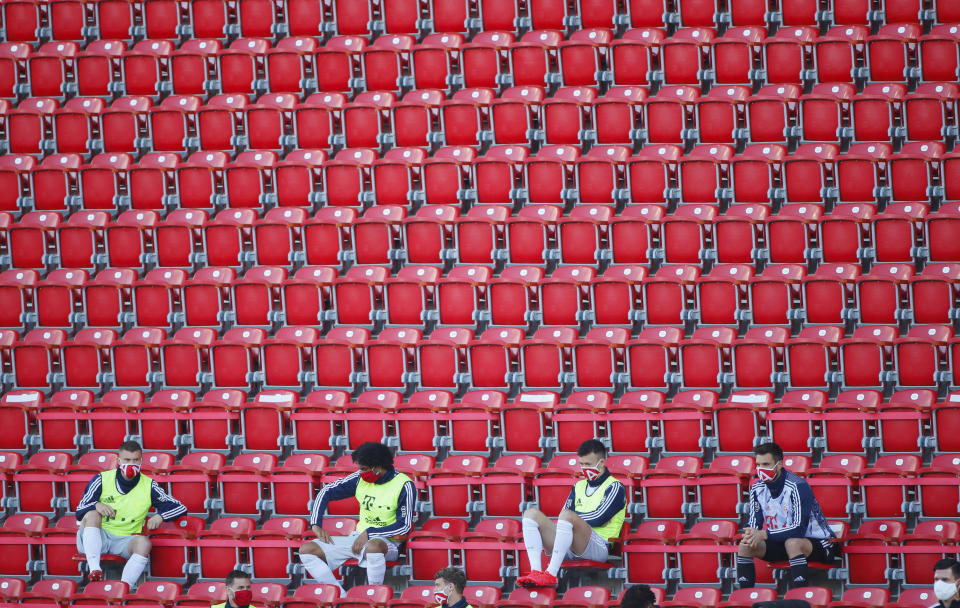 Substitute player of Bayern Munich are seen during the German Bundesliga soccer match between Union Berlin and Bayern Munich in Berlin, Germany, Sunday, May 17, 2020. The German Bundesliga becomes the world's first major soccer league to resume after a two-month suspension because of the coronavirus pandemic. (AP Photo/Hannibal Hanschke, Pool)