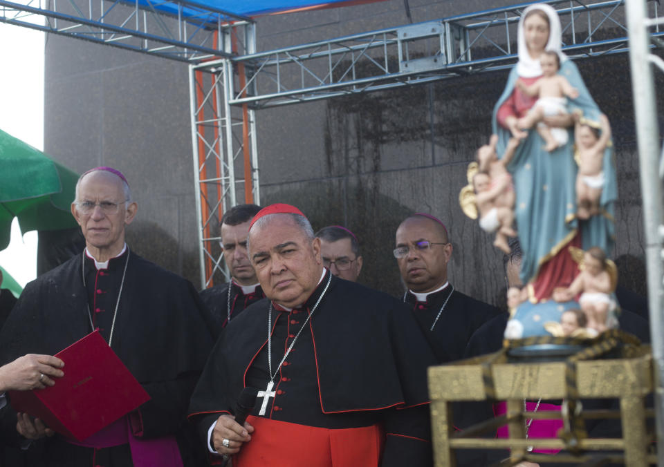 Archbishop of Rio de Janeiro Dom Orani Tempesta, center, attends a Catholic church event against the legalization of abortion, in Rio de Janeiro, Brazil, Thursday, Aug. 2, 2018. A public hearing to discuss the decriminalization of abortion in Latin America's biggest country will be held Friday at Brazil's Supreme Court. (AP Photo/Silvia Izquierdo)