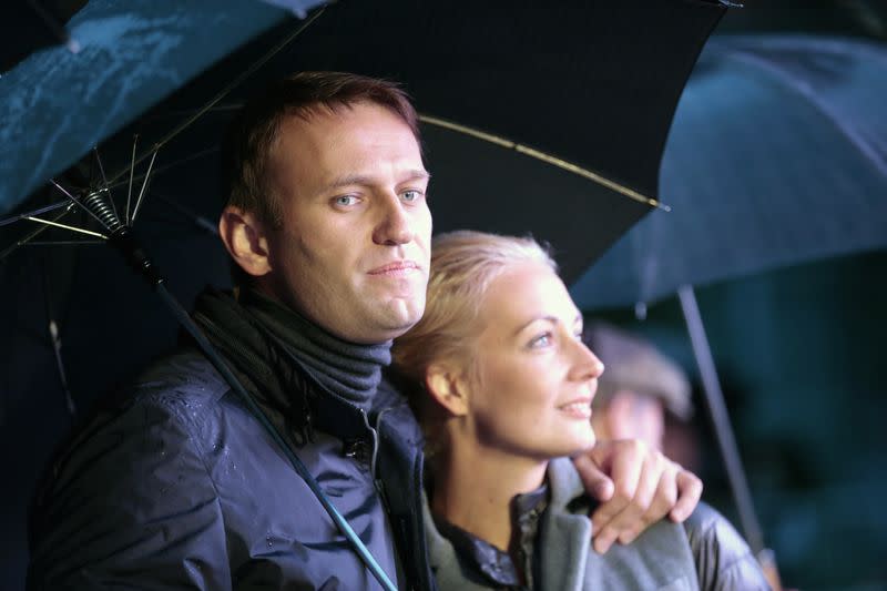 Mayoral candidate and opposition leader Navalny and his wife Yulia look on during a support rally in central Moscow