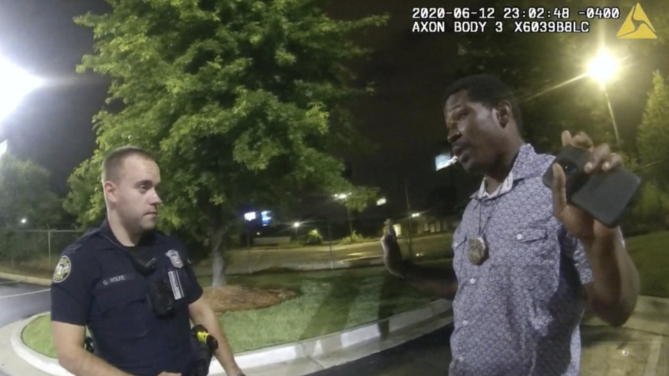 A body cam image showing Rayshard Brooks speaking with Officer Garrett Rolfe (left) before the fatal shooting. Source: AP