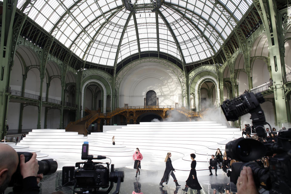 Models wear creations for the Chanel fashion collection during Women's fashion week Fall/Winter 2020/21 presented in Paris, Tuesday, March 3, 2020. (AP Photo/Thibault Camus)