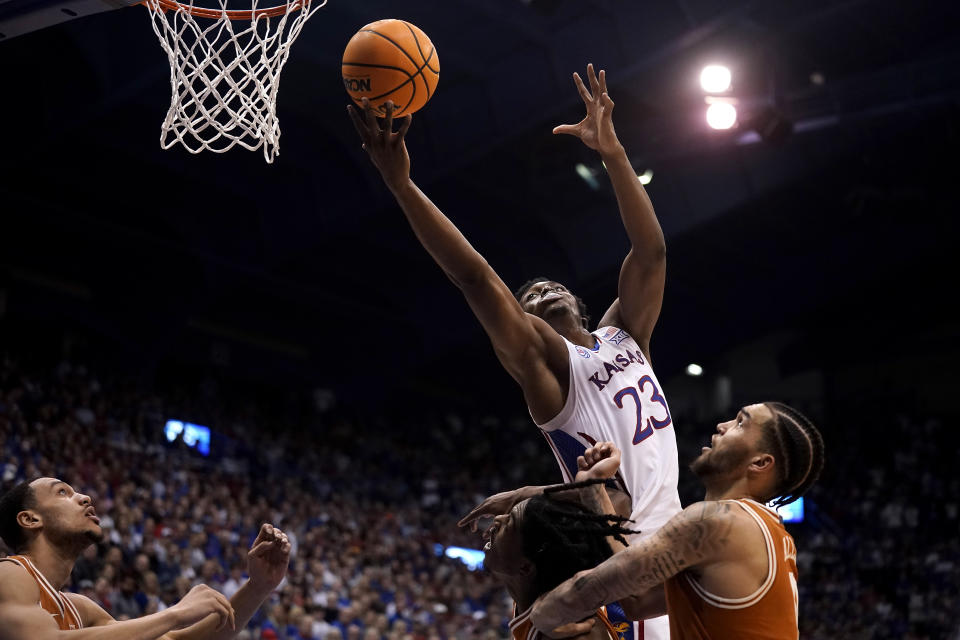 Kansas center Ernest Udeh Jr. (23) shoots during the first half of an NCAA college basketball game against Texas Monday, Feb. 6, 2023, in Lawrence, Kan. (AP Photo/Charlie Riedel)