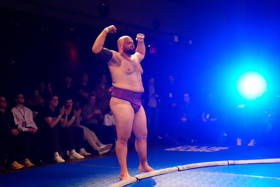 Sahlan flexes before a match at the Club Sumo event. The Egyptian native is the first African to become a pro sumo wrestler in the sport's homeland of Japan.