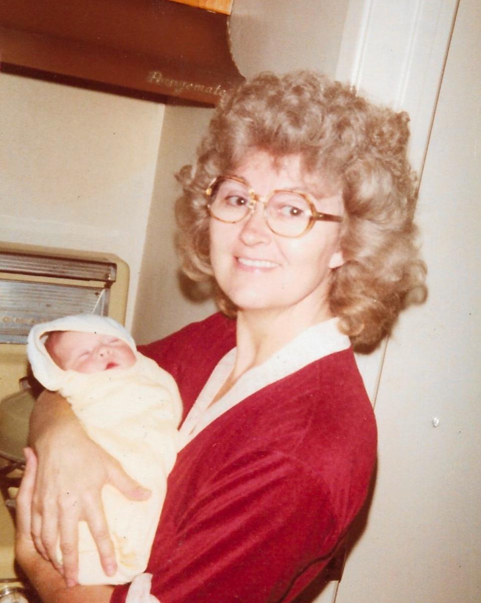 Kathleen holding the author when she was a baby.