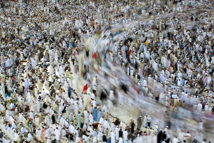 Tens of thousands of Muslim pilgrims moving around the Kaaba, unseen, inside the Grand Mosque, in Mecca, Saudi Arabia, Sunday, Oct. 30, 2011. The annual Islamic pilgrimage draws 2.5 million visitors each year, making it the largest yearly gathering of people in the world. The Hajj will start on 5 November. (AP Photo/Hassan Ammar)