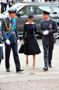 <p>Meghan wore black midi dress for the occasion which featured a boat neck and a flare skirt. </p>