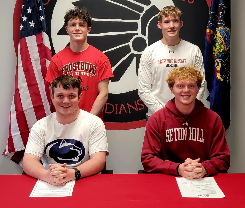 Conemaugh Township senior athletes, front row, from left, Sam Sharbaugh and Dylan Giffin, back row, Tristen Hawkins and Colten Huffman made their college declarations at a ceremony on May 9, in Davidsville.