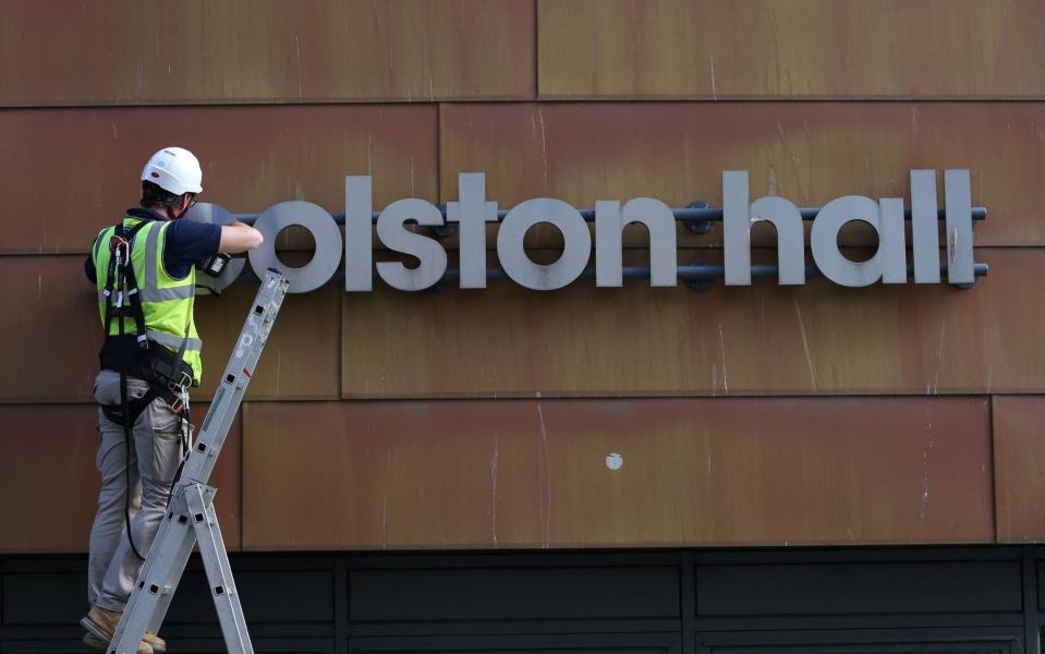 Workmen remove the Colston Hall name sign - Tom Wren / SWNS