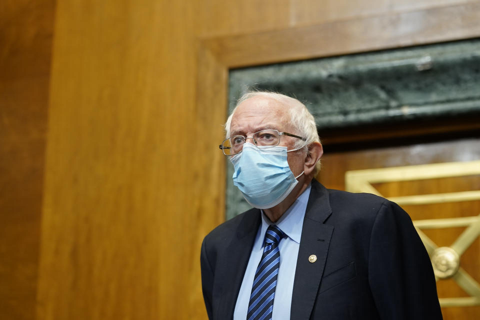 Senate Budget Committee Chairman Sen. Bernie Sanders, I-Vt., arrives for a hearing on Capitol Hill in Washington, Thursday, Feb. 25, 2021, examining wages at large profitable corporations. (AP Photo/Susan Walsh, Pool)