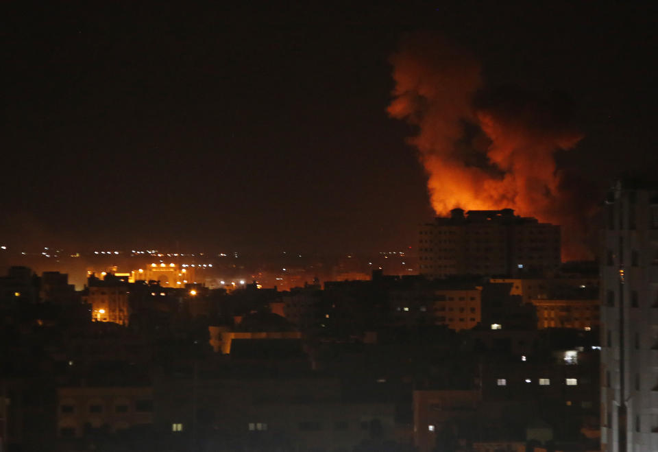 Smoke rises from an explosion caused by an Israeli airstrike on Gaza City, early Saturday, Oct. 27, 2018. Israeli aircraft struck several militant sites across the Gaza Strip early Saturday shortly after militants fired rockets into southern Israel, the Israeli military said. (AP Photo/Adel Hana)