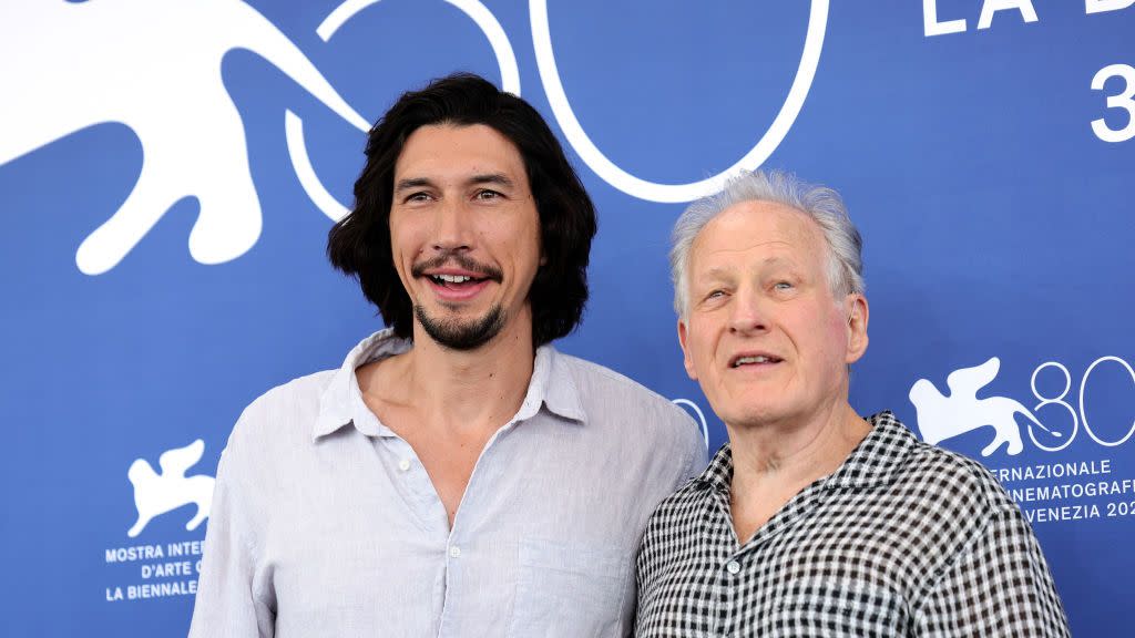 adam driver and michael mann embracing for a photo at the ferrari premiere