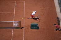 Serbia's Novak Djokovic returns the ball to Stefanos Tsitsipas of Greece during their final match of the French Open tennis tournament at the Roland Garros stadium Sunday, June 13, 2021 in Paris. (AP Photo/Christophe Ena)