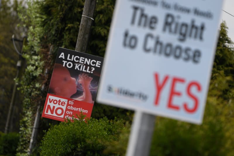 Pro-Life and Pro-Choice posters stand side-by-side on a roadside in Ireland