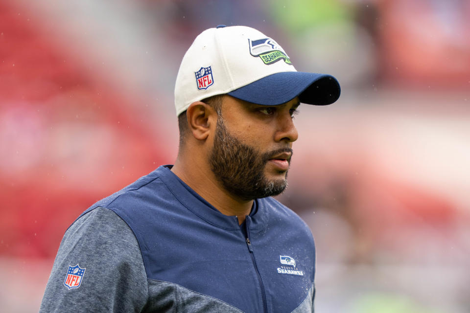 Seattle Seahawks associate head coach - defense Sean Desai walks the field before a game at the San Francisco 49ers, Sept. 18, 2022.