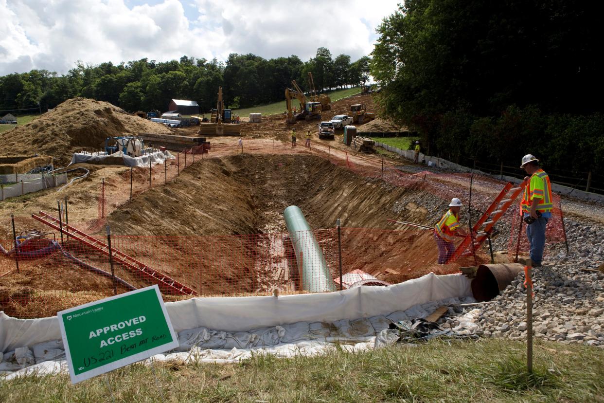 Construction crews bore beneath U.S. 221 in Roanoke County, Va., to make a tunnel through which the Mountain Valley Pipeline will pass under the highway.