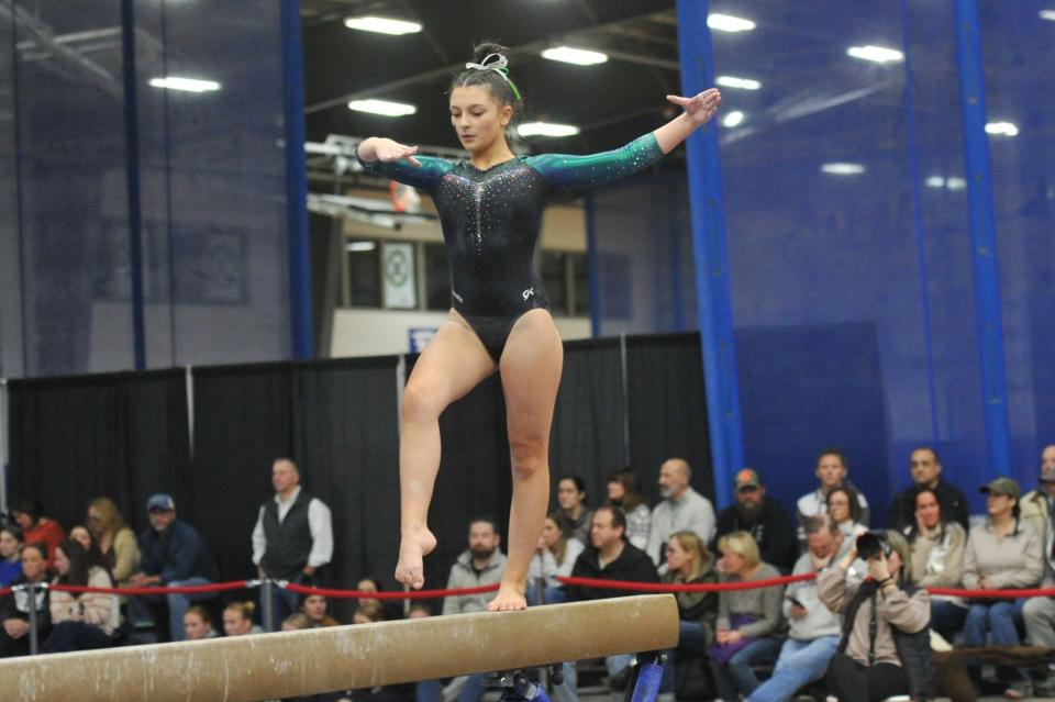 Marshfield's Maya Overton competes on the balance beam at the Patriot League gymnastics meet at Starland in Hanover, Friday, Feb. 9, 2024.