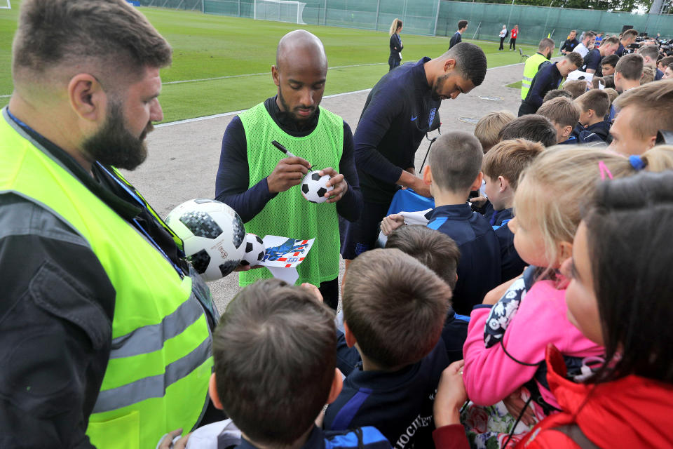  Fabian Delph and Ruben Loftus-Cheek stop to sign autographs after the training session. (Getty)