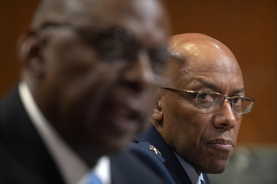 Chairman of the Joint Chiefs of Staff Air Force Gen. CQ Brown, right, listens as Secretary of Defense Lloyd Austin, left, speaks during a hearing of the Senate Appropriations Committee Subcommittee on Defense on Capitol Hill, Wednesday, May 8, 2024, in Washington. (AP Photo/Mark Schiefelbein)