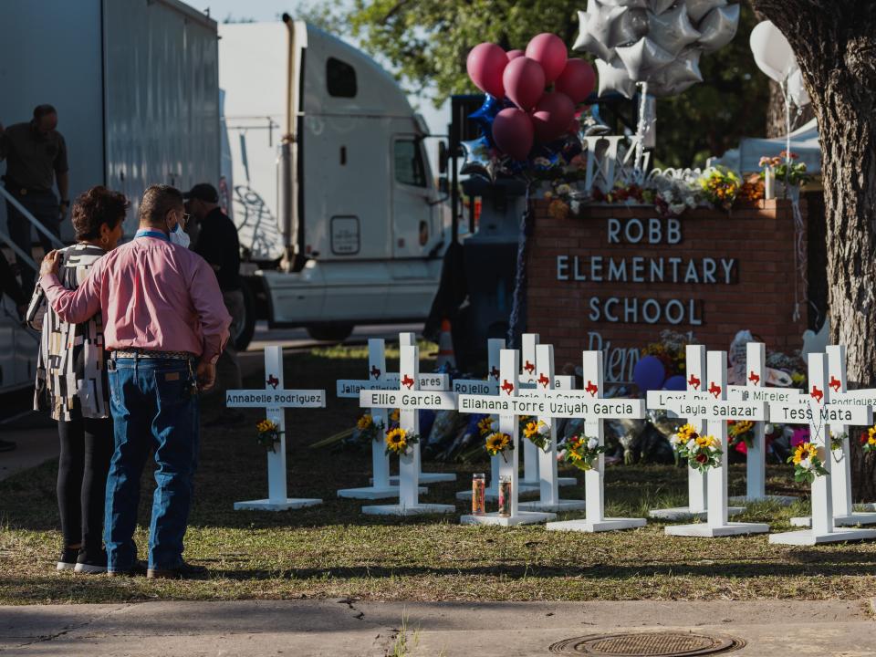 Crosses bearing the names of the victims of a mass shooting in front of Robb Elementary School on May 26, 2022 in Uvalde, Texas. The rural Texas community is in mourning following a shooting at Robb Elementary School which killed 21 people including 19 children.